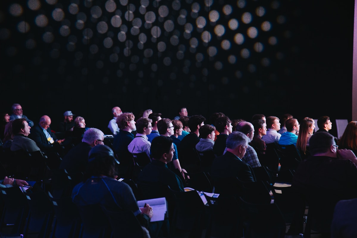 Conference attendees seated during a session